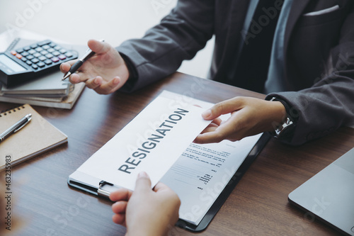 Photography The businesswoman sending a letter of resignation to the boss but the boss didn't want to resign