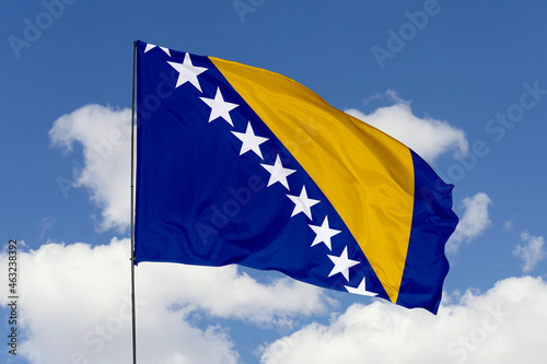 Bild auf Leinwand Bosnia and Herzegovina flag isolated on the blue sky background