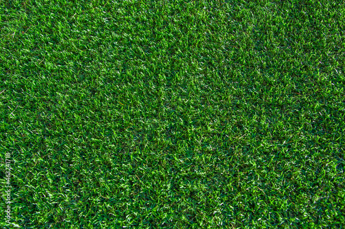 Green grass background. Lawn, football field, green grass artificial turf, texture, top view. summer lawn background