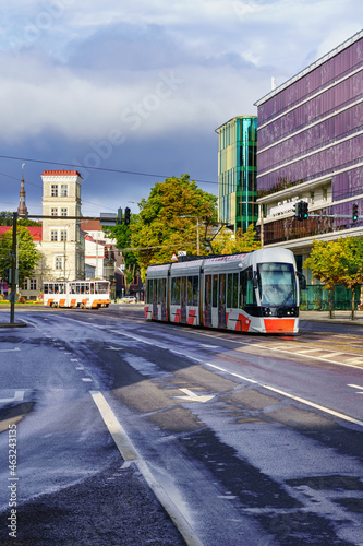 Trams in Tallinn city on cloudy day after raining.