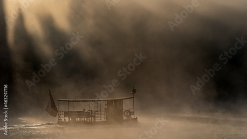 Amazing foggy view of small ferry boat in Prague.