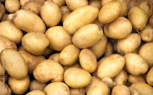 Pile of fresh potatoes on sale in vegetable stand display at supermarket show organic food  vegetarian food  Healthy food. Heap of potato sale in market use for texture and background.