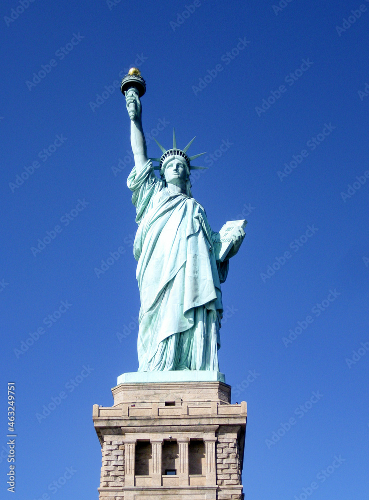 Fototapeta premium Statue of Liberty in New York isolated against a deep blue sky. No people. Copy space.