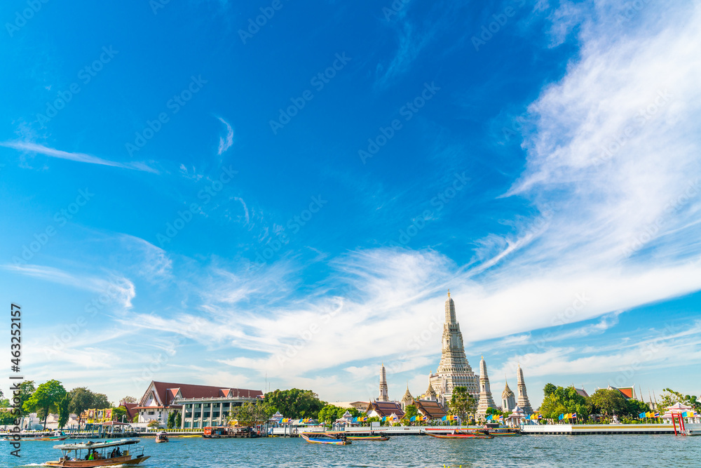 Travel boat in Chao phra Ya river background with temple of dawn Travel boat in Chao phra Ya river background with temple of dawn