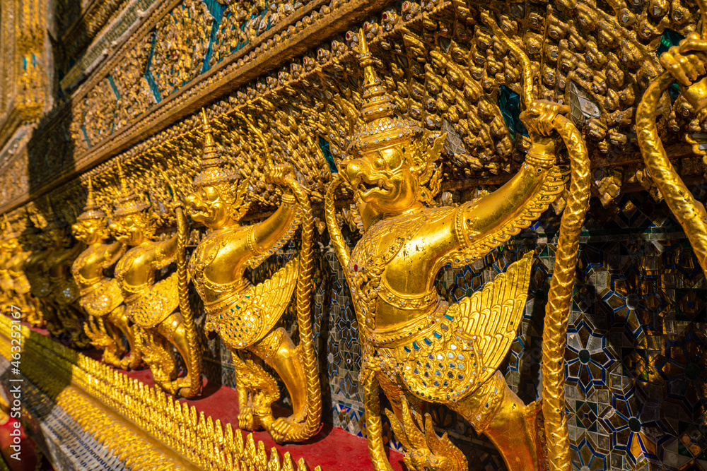 Golden giant angel statue stand in temple of emerald buddha