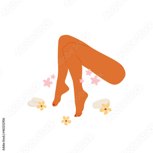 Female legs with a pedicure. Pedicure with flowers and stones. Noe and toenail care. Beauty and spa treatments.