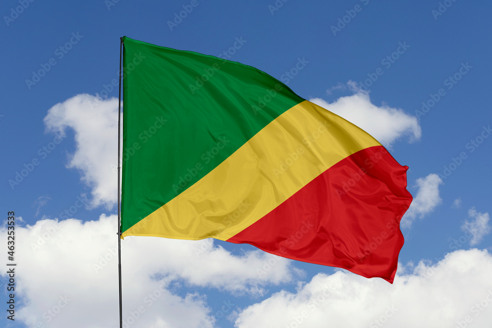 Congo flag isolated on the blue sky background. close up waving flag of Congo. flag symbols of Congo. Concept of Congo. Congo flag isolated on the blue sky background. close up waving flag of Congo. flag symbols of Congo. Concept of Congo.