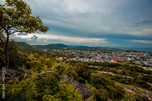 The view of the natural background of the mountain close-up, with blurred fog scattered in the rainy season or the humid climate, with beautiful green trees in the ecological system