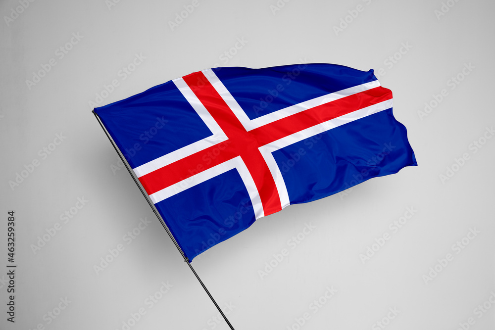 Obraz premium Iceland flag isolated on white background. close up waving flag of Iceland. flag symbols of Iceland. Concept of Iceland.