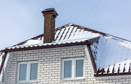 Snow on the roof of the house