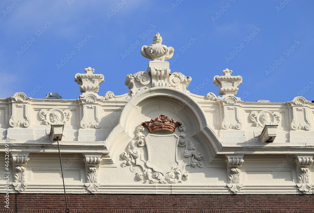 Fototapeta premium Amsterdam Keizersgracht Canal House Sculpted Facade Top with Crown Close Up, Netherlands.