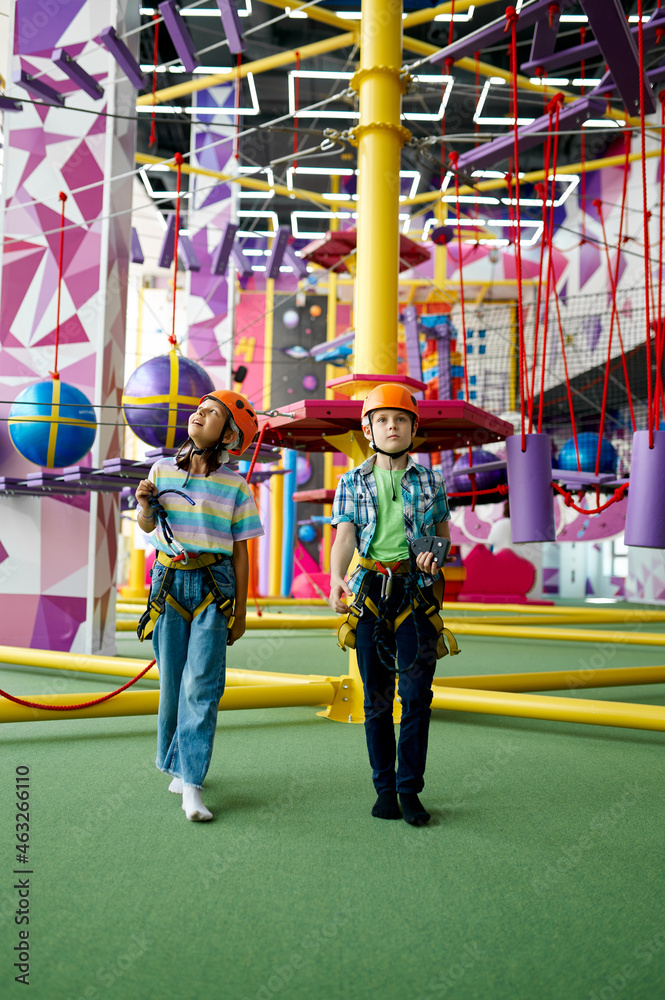 Obraz premium Children in helmets, young climbers, front view