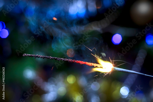 Holiday background with a sparkler.