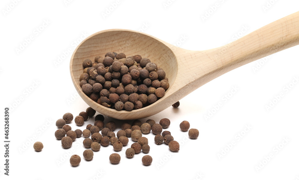 Allspice, pimento spice, Jamaican pepper pile in wooden spoon isolated on white background Allspice, pimento spice, Jamaican pepper pile in wooden spoon isolated on white background