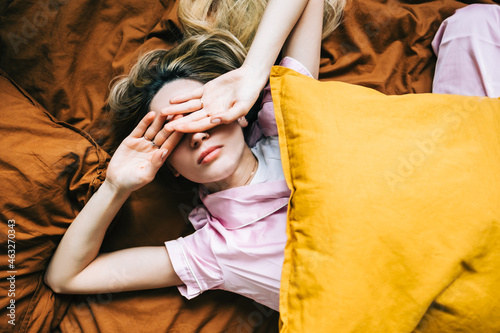 Quadro em tela Young caucasian woman waking up alone in the morning.