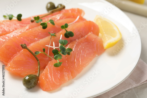 Delicious salmon carpaccio served on table, closeup