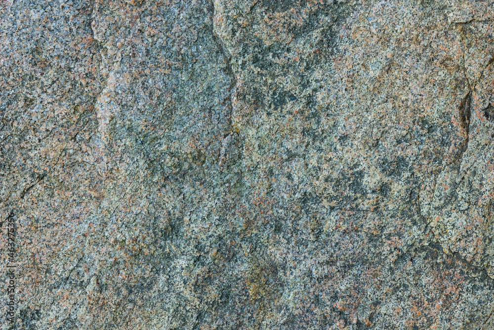 Natural stone texture. Granite surface of sheer cliff. Solid rock close-up Natural stone texture. Granite surface of sheer cliff. Solid rock close-up