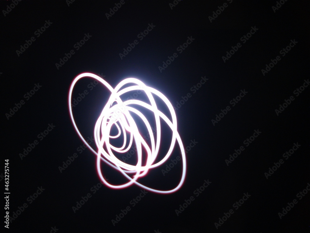 Long exposure photograph in an abstract waves, a black background. Light painting photography. Long exposure photograph in an abstract waves, a black background. Light painting photography.