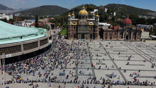 Aerial view of the sacred Basilica Virgin of Guadalupe with a lot of visitors during a sunny weekend in Mexico City, Mexico.