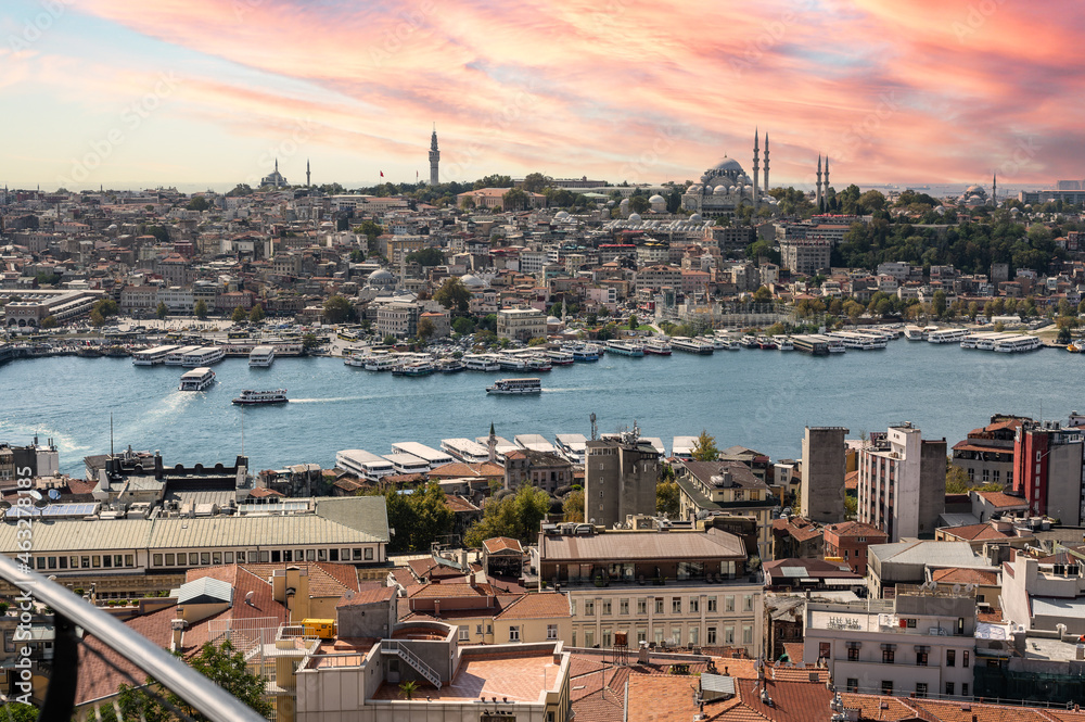 ISTANBUL, TURKEY - OCTOBER 12 ,2021: Istanbul city view from Galata tower in Turkey. Golden Horn bay of Istanbul and view on mosque with Sultanahmet district. sunset