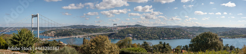 ISTANBUL, TURKEY - OCTOBER 12 ,2021: Panoramic view of Istanbul Bosphorus. Istanbul Fatih Sultan Mehmet Bridge. cloudy blue sky. panorama