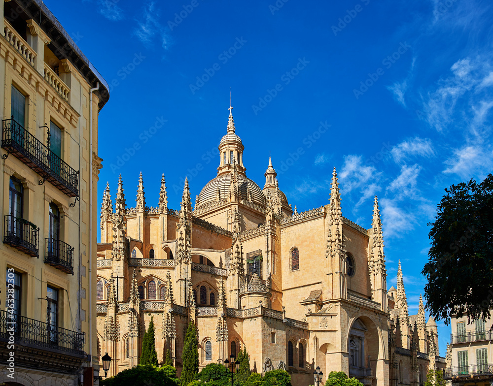 North facade of the Cathedral of Segovia, a catholic temple devoted to the Assumption of the Virgin Mary and San Frutos. View from Plaza Mayor square. Segovia, Spain. North facade of the Cathedral of Segovia, a catholic temple devoted to the Assumption of the Virgin Mary and San Frutos. View from Plaza Mayor square. Segovia, Spain.