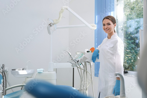 Fototapeta Naklejka Na Ścianę i Meble -  Portrait of professional dentist at workplace in clinic