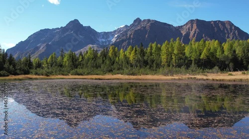 Alpine lake and forest in autumn.
The mountain reflected in the water