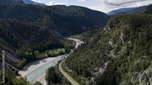 Medium shot of clouds and train passing by in the rhine ravine, timelapse. photo