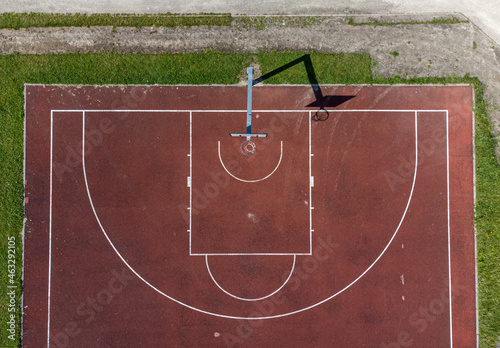 basketball court drone aerial view in beautiful light and showing shadow of hoop Drone aerial view photo