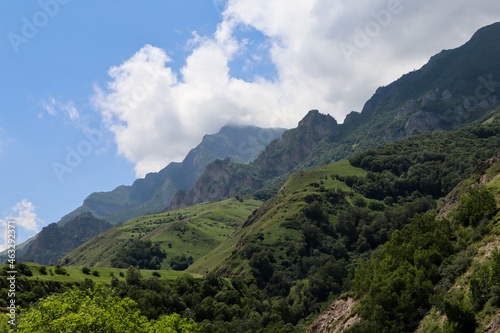clouds over the beautiful green Caucasus mountains landscape