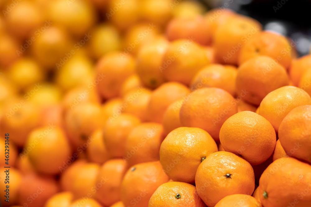 texture of yellow tangerines or mandarins, natural background, selective focus, side view texture of yellow tangerines or mandarins, natural background, selective focus, side view