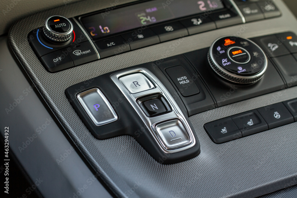 Modern car automatic gearbox. Gearbox control buttons. Gear selector close up.