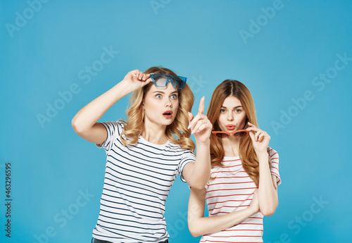 two cute women in striped t-shirts fashion friendship