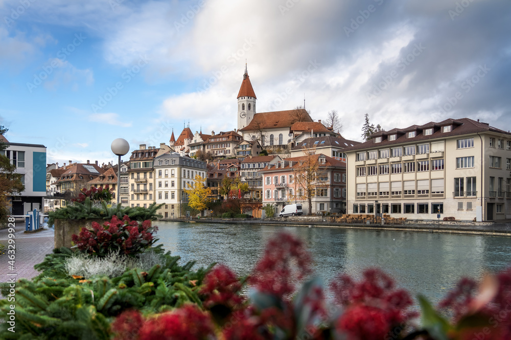 Colorful view of Aare river promenade and Thun Skyline with Thun City Church (Stadtkirche) and Thun Castle - Thun, Switzerland