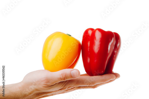 Comparison and differentiation, Conceptual shot of red and yellow paprika.