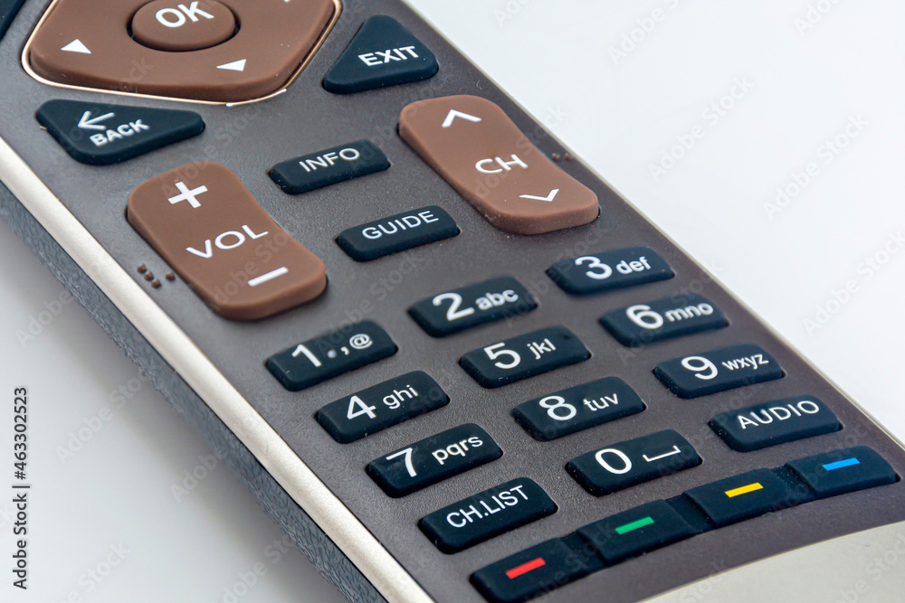 remote control from the TV on a white background. Close-up of a TV remote control. selective focus. remote control from the TV on a white background. Close-up of a TV remote control. selective focus.