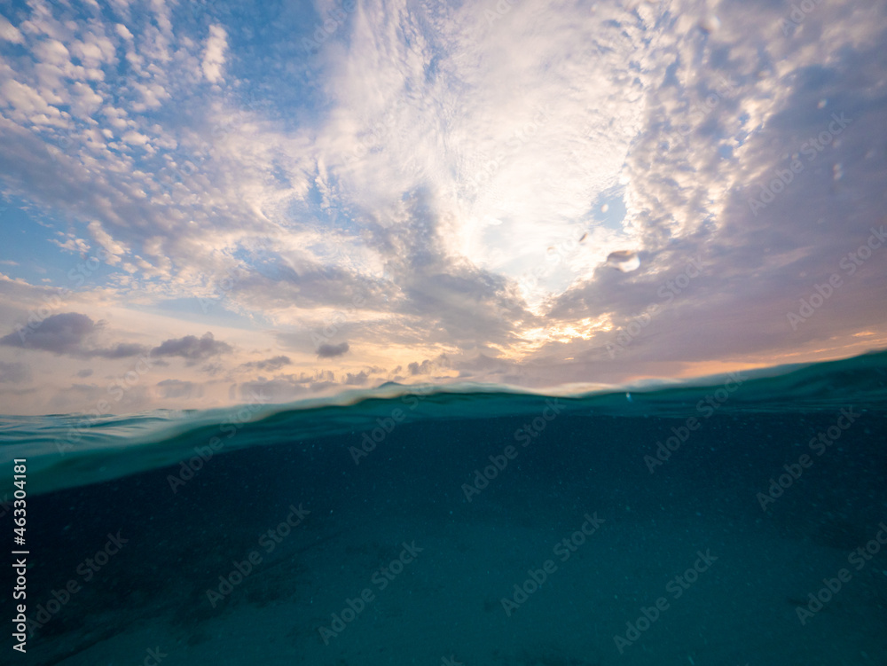 beautiful clouds and big sunrise sky above water