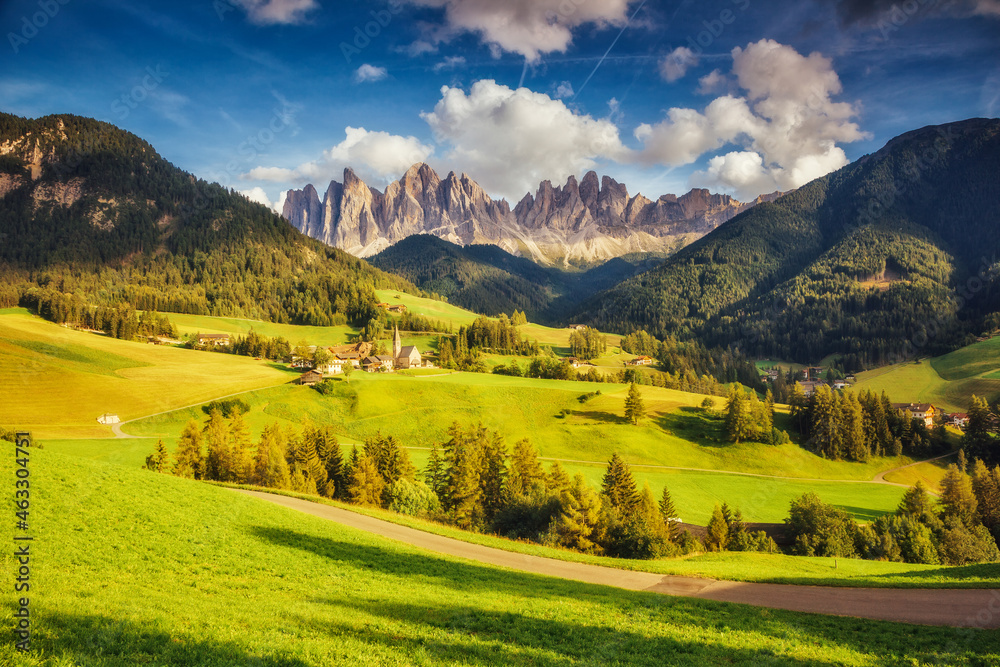 Countryside view of the Funes valley St. Magdalena or Santa Maddalena in the National park Puez Odle or Geisler. Dolomites, South Tyrol. Location Bolzano, Italy, Europe. Dramatic scene. Beauty world.