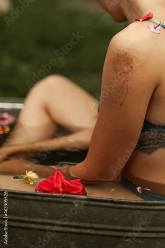 girl in the bathroom with flowers on the street in beautiful underwear