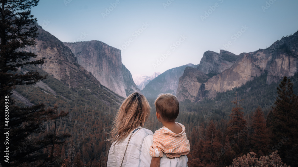 Mother and son at Yosemite National Park, Mountains and Valley view. California, USA