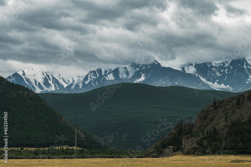 View beyond the snow-capped peaks of the mountains near Aktash in the Altai Republic