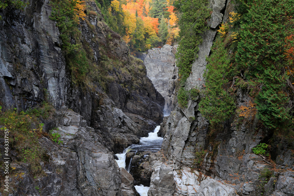 Canyon Sainte-Anne waterfall in autumn, Quebec, Canada