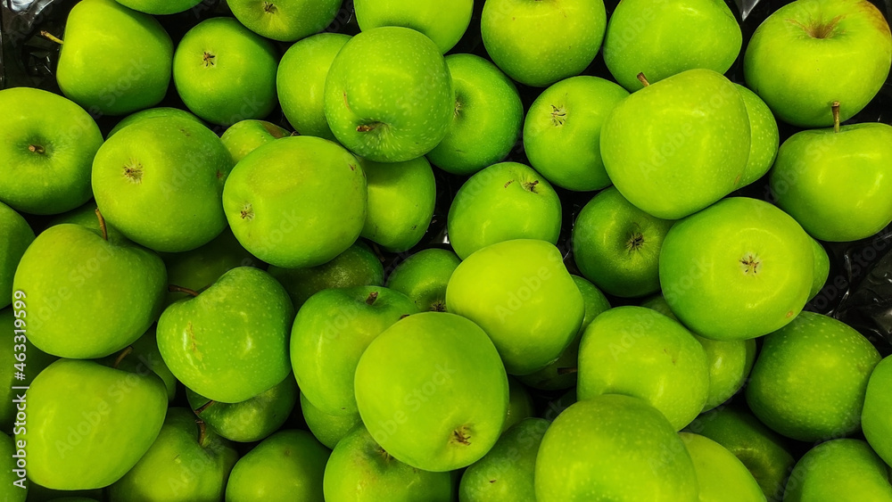 Fresh organic raw green apples background. Top view of ripe green apples Fresh organic raw green apples background. Top view of ripe green apples