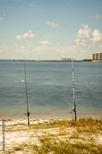 Fishing poles in the sand