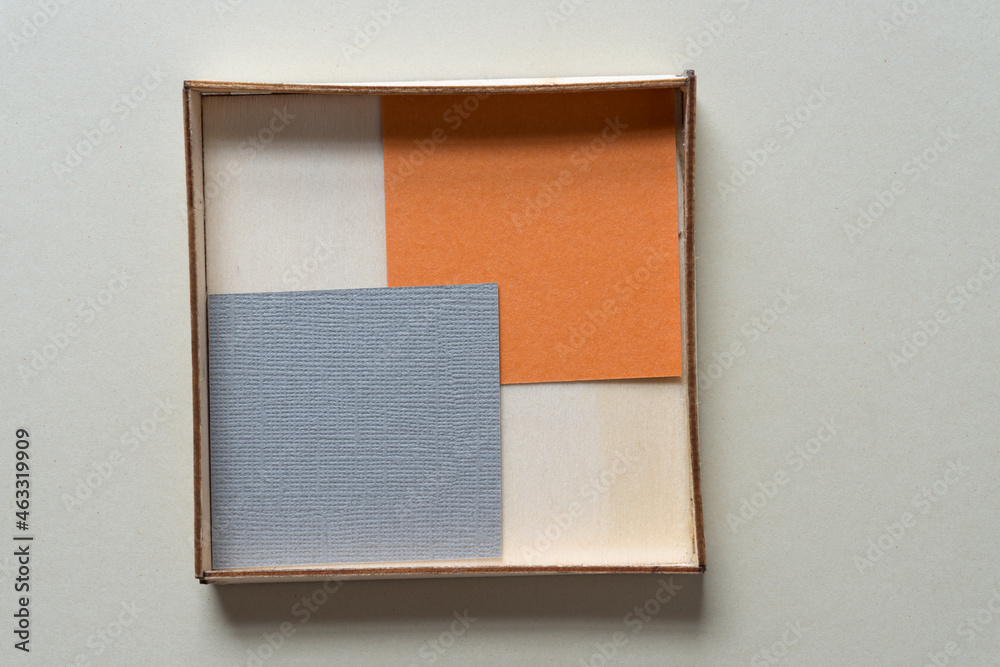 Fototapeta premium paper squares inside a wooden box