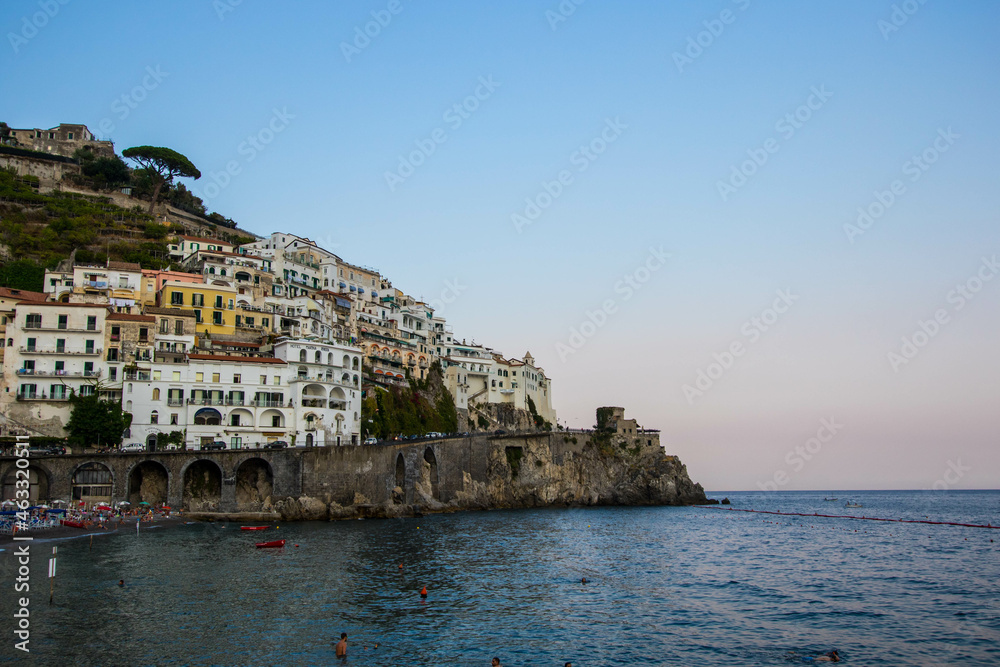 Naklejka premium AMalfi, Italy : 03 april 2019 : Panoramic view of beautiful Amalfi on hills leading down to coast, Campania, Italy. Amalfi coast is most popular travel and holiday destination in Europe.