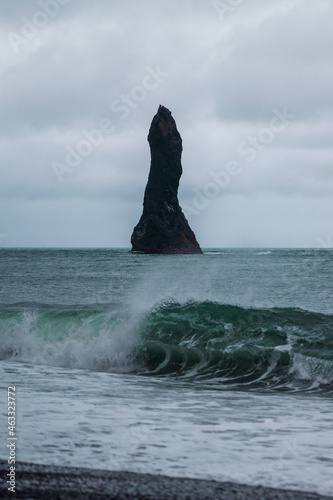 pillar in ocean with wave  © John
