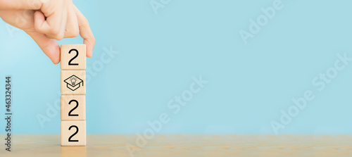 2022 Education New year.Man holding wooden block.2022 idea education.Happy new year school class academic calendar, Student teacher educational celebration, University background banner.Success idea.