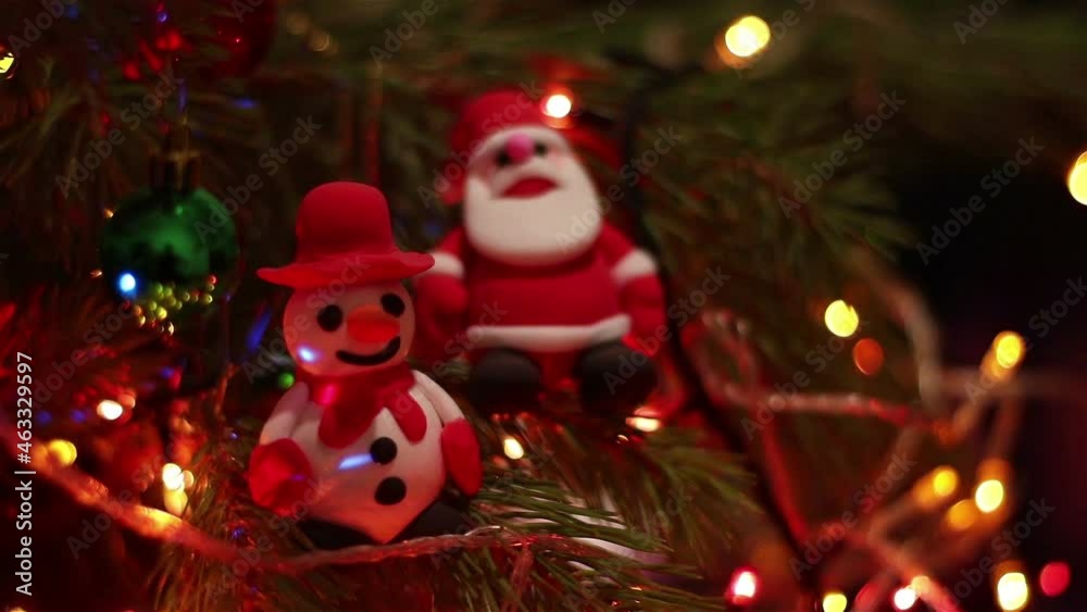cute snowman and santa claus toys spruce tree and christmas lights . happy new year festive video cute snowman and santa claus toys spruce tree and christmas lights . happy new year festive video
